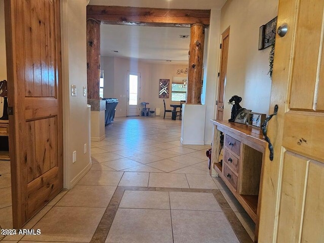 hall with light tile patterned floors