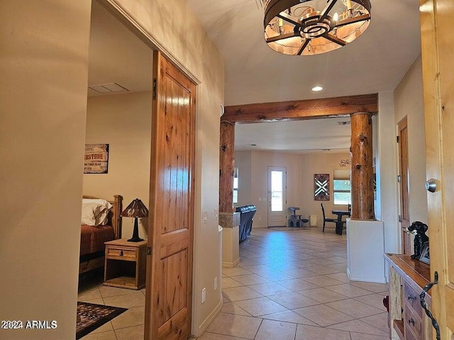 corridor with light tile patterned floors