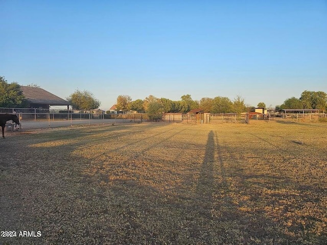 view of yard with a rural view