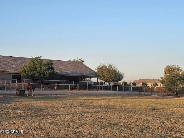 view of yard at dusk