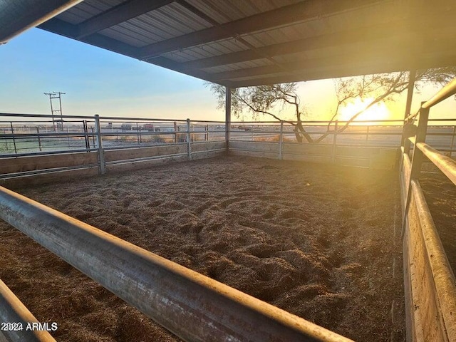 view of stable featuring a rural view