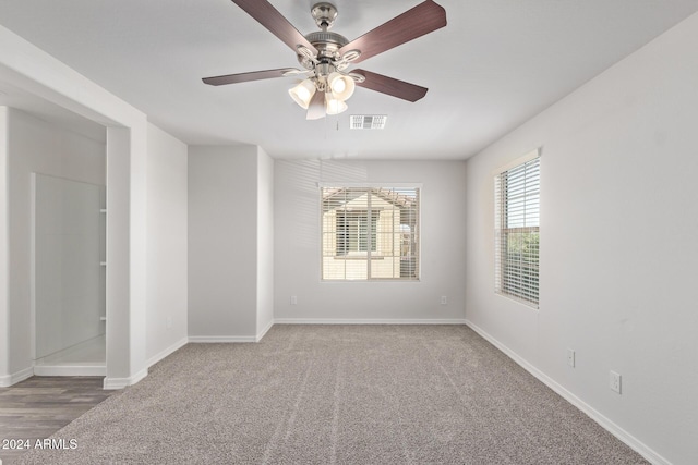 carpeted empty room with ceiling fan