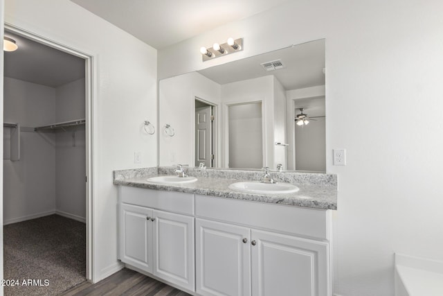 bathroom featuring ceiling fan, vanity, and hardwood / wood-style flooring