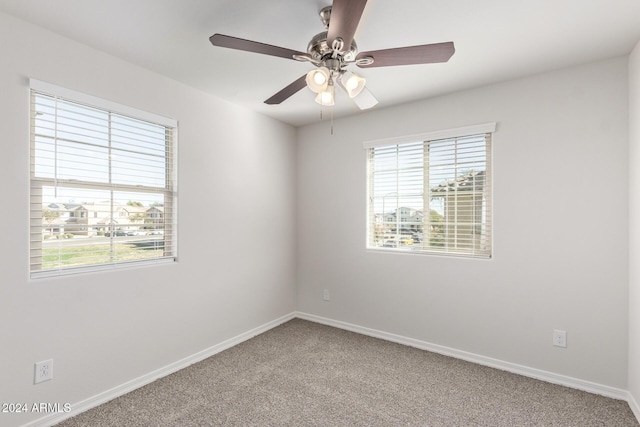 empty room featuring carpet and ceiling fan