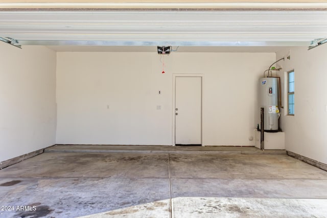 garage with a garage door opener and water heater