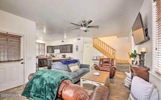 2600 W Old Linden Rd, Show Low, AZ 85901 - living room with stairs, ceiling fan, and stone finish flooring