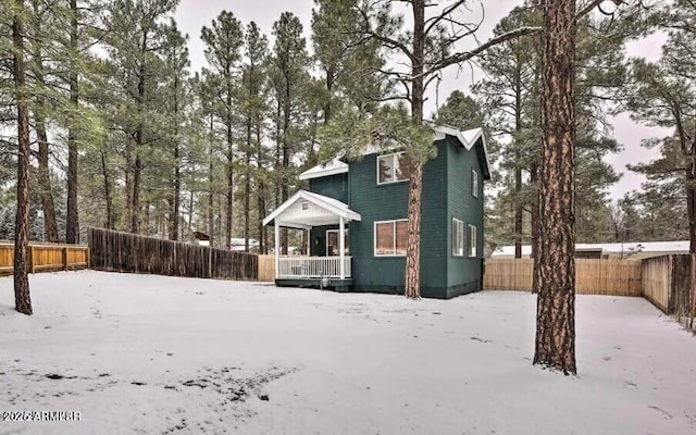 2600 W Old Linden Rd, Show Low, AZ 85901 - view of front facade with fence, crawl space, and a porch