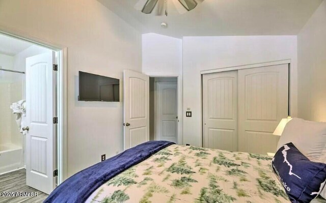 2600 W Old Linden Rd, Show Low, AZ 85901 - bedroom with lofted ceiling, a closet, wood finished floors, and a ceiling fan