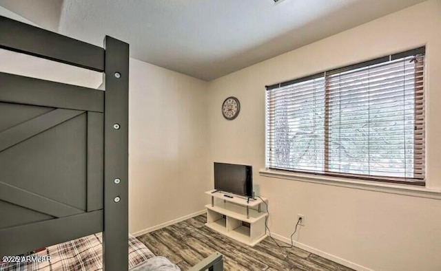 2600 W Old Linden Rd, Show Low, AZ 85901 - unfurnished room with baseboards, wood finished floors, and plenty of natural light