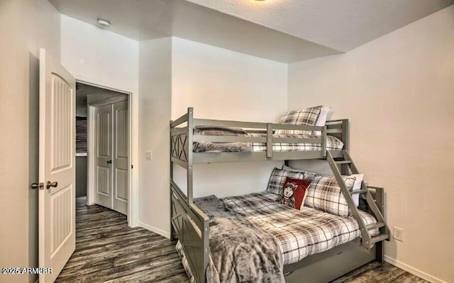 2600 W Old Linden Rd, Show Low, AZ 85901 - bedroom with dark wood finished floors and baseboards