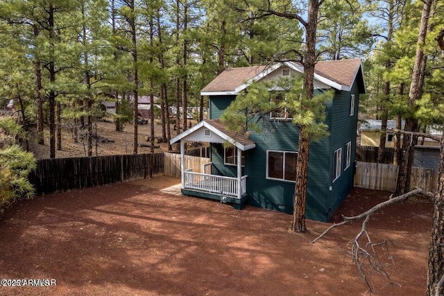 2600 W Old Linden Rd, Show Low, AZ 85901 - rear view of house featuring covered porch, fence, and a shingled roof