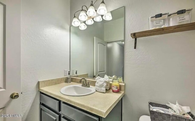 2600 W Old Linden Rd, Show Low, AZ 85901 - bathroom featuring a textured wall and vanity