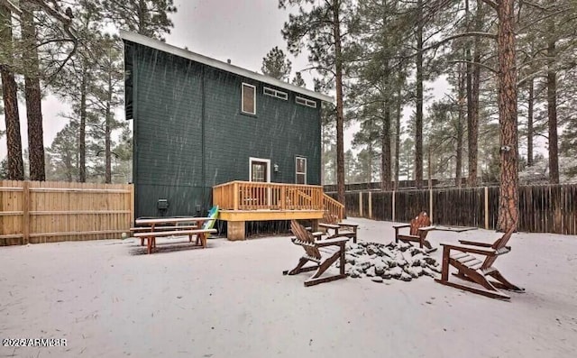 2600 W Old Linden Rd, Show Low, AZ 85901 - back of property with a deck, a fenced backyard, and a fire pit