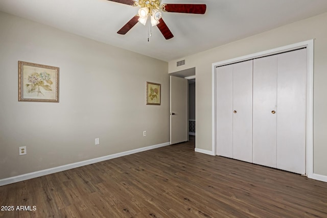 10001 W Caron Dr, Sun City, AZ 85351 - unfurnished bedroom featuring wood finished floors, baseboards, and a closet