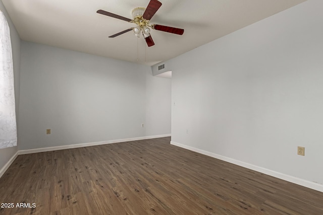 10001 W Caron Dr, Sun City, AZ 85351 - empty room with dark wood-style floors, ceiling fan, and baseboards