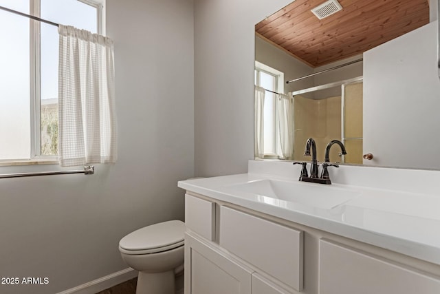 10001 W Caron Dr, Sun City, AZ 85351 - bathroom with vanity, wooden ceiling, toilet, a shower, and baseboards