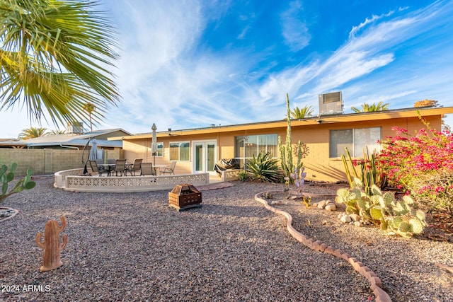 10001 W Caron Dr, Sun City, AZ 85351 - back of house with a fire pit, a patio area, french doors, and outdoor dining area