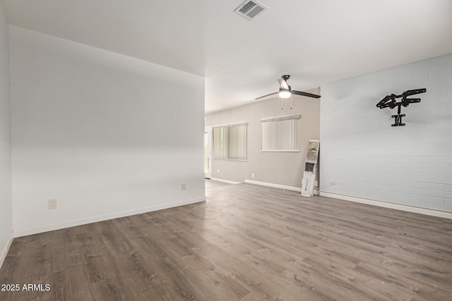 10001 W Caron Dr, Sun City, AZ 85351 - unfurnished living room featuring wood finished floors, ceiling fan, and baseboards