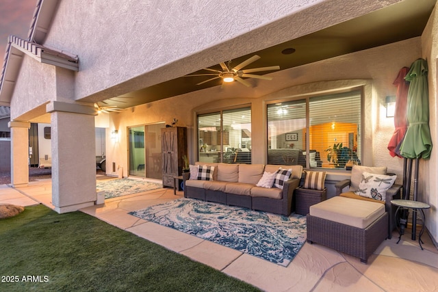 view of patio with an outdoor living space and ceiling fan