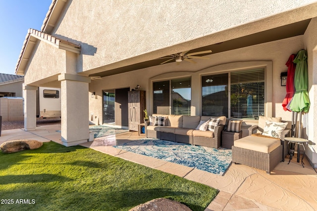 view of patio featuring an outdoor living space and ceiling fan