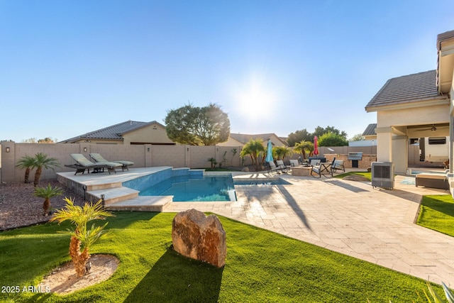 view of swimming pool with a patio