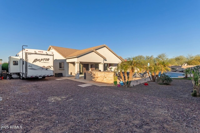 view of front of house featuring an outdoor kitchen