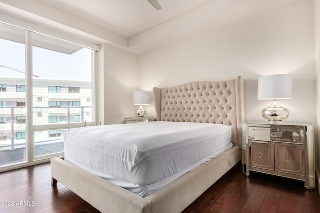 bedroom with dark hardwood / wood-style flooring, access to outside, multiple windows, and ceiling fan