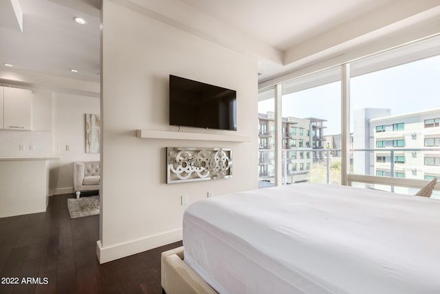 bedroom featuring access to outside and dark hardwood / wood-style flooring