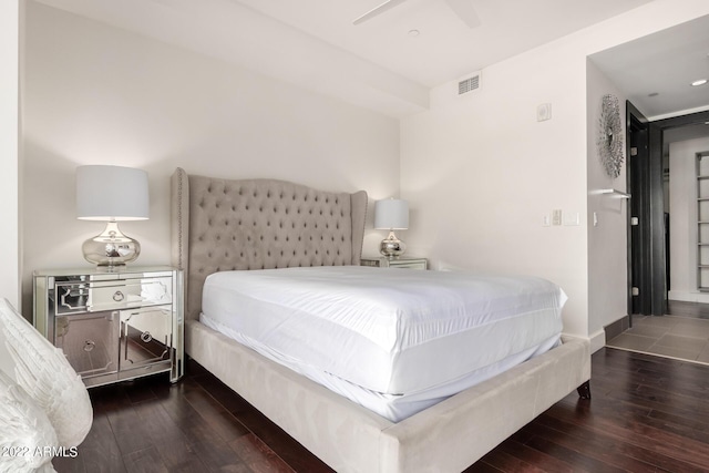 bedroom featuring ceiling fan and dark hardwood / wood-style floors