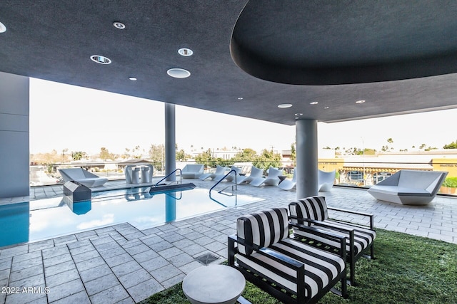 view of patio with a fenced in pool