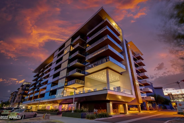 view of outdoor building at dusk