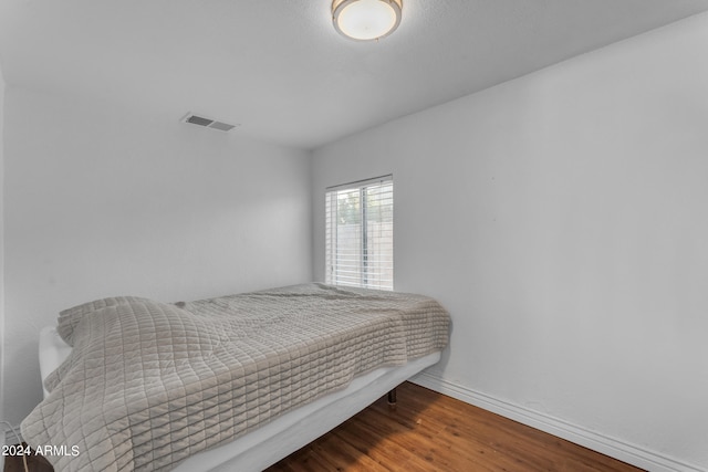 bedroom featuring hardwood / wood-style flooring