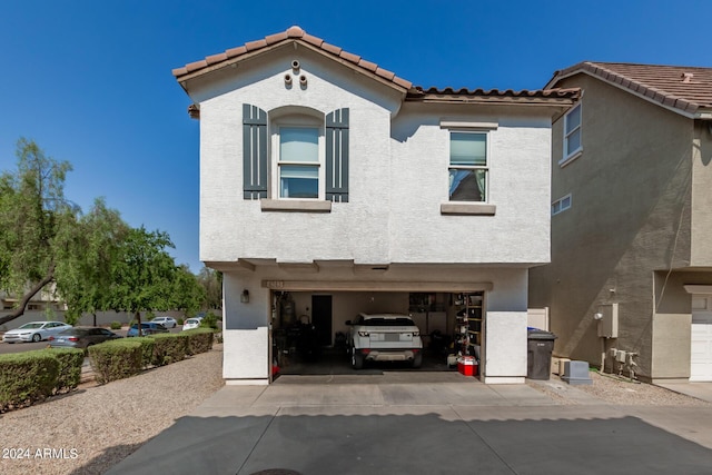 4243 E Jasper Dr, Gilbert, AZ 85296 - view of front of house with an attached garage, a tiled roof, stucco siding, and concrete driveway
