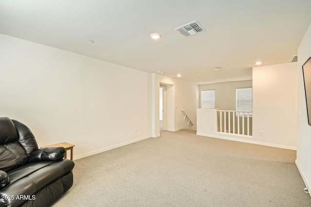 living area featuring light colored carpet