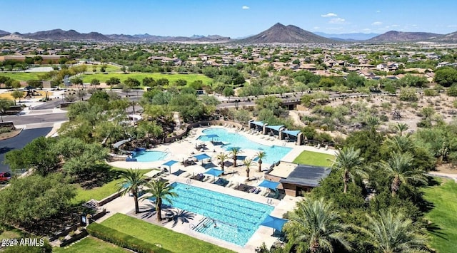 birds eye view of property featuring a mountain view