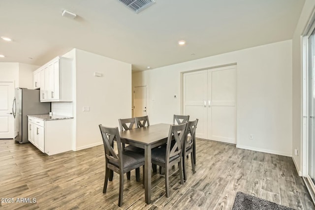 dining area featuring light hardwood / wood-style floors