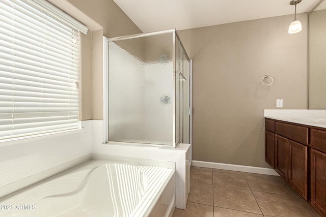 full bathroom with baseboards, a garden tub, a stall shower, tile patterned floors, and vanity