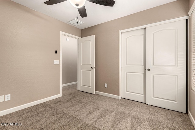 unfurnished bedroom featuring visible vents, baseboards, carpet floors, ceiling fan, and a closet