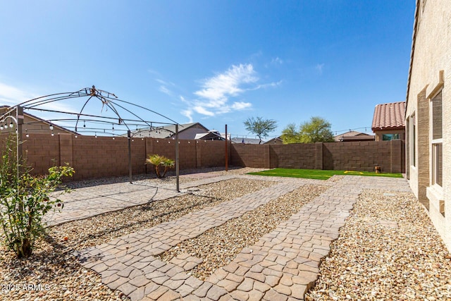 view of yard with a patio area and a fenced backyard