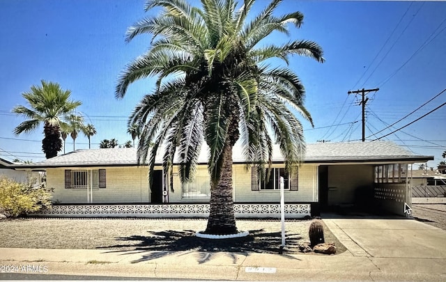 view of front of home featuring a carport