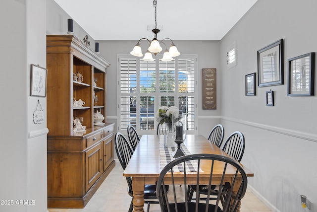 dining room with a chandelier