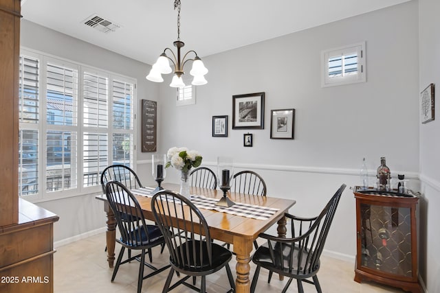 dining space featuring an inviting chandelier