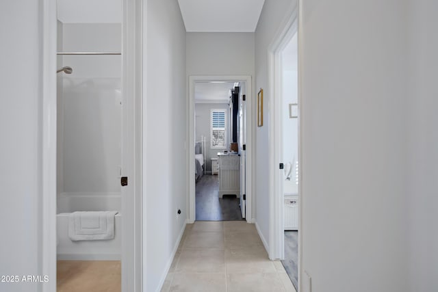 corridor featuring light tile patterned floors