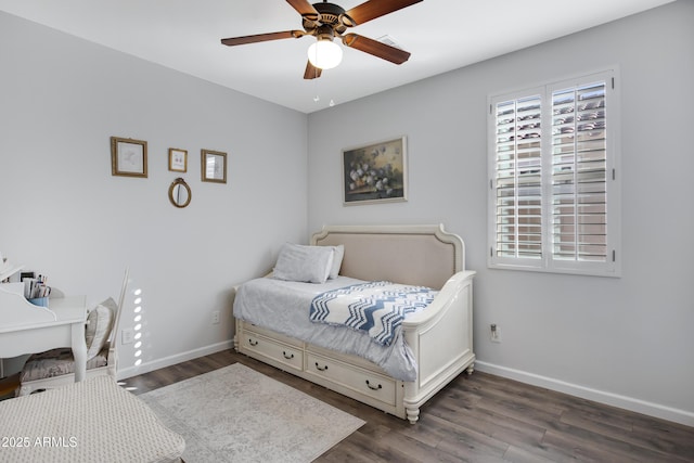 bedroom with dark wood-type flooring and ceiling fan