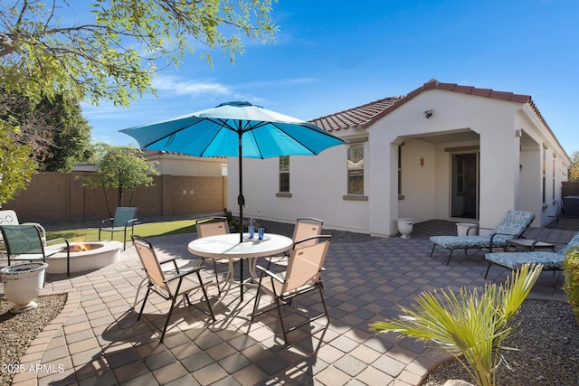 view of patio / terrace featuring a fire pit