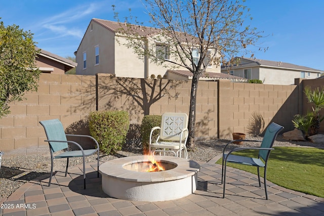 view of patio with an outdoor fire pit