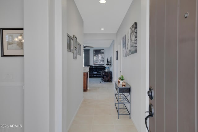 corridor with light tile patterned floors