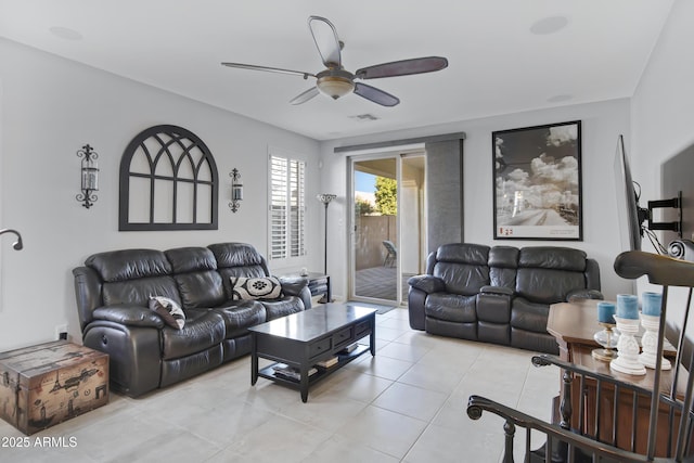 living room featuring ceiling fan and light tile patterned flooring