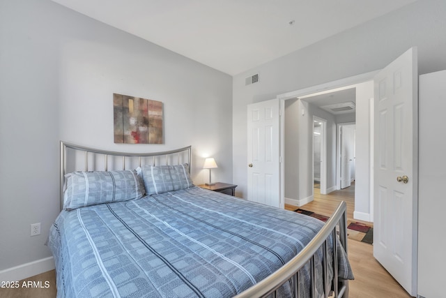 bedroom featuring wood-type flooring