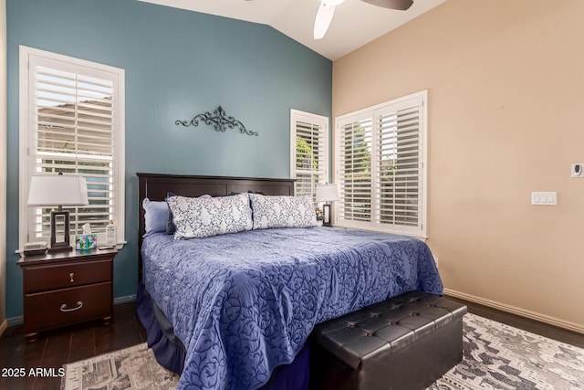 bedroom with a ceiling fan, baseboards, vaulted ceiling, and wood finished floors